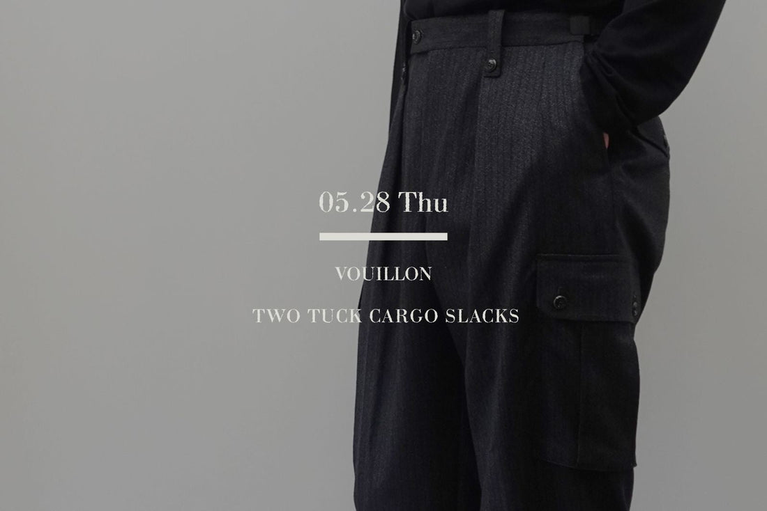 Ermenegildo Zegna（エルメネジルドゼニア）社のチャコールストライプデッドストック生地を使用した、VOUILLON（ヴイヨン）のTWO TUCK CARGO SLACKS（2タックカーゴスラックス）。中央に「05.28 Thu VOUILLON TWO TUCK CARGO SLACKS」の白いブランドロゴテキスト。